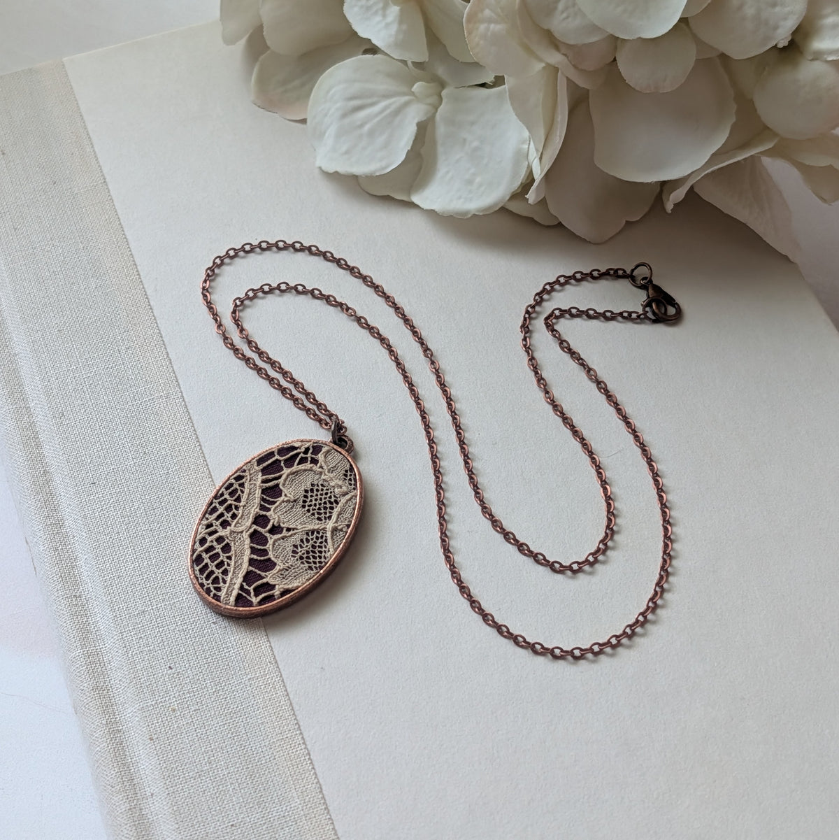 Copper Oval Pendant With 1920s French Lace On Burgundy Cotton