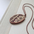 Load image into Gallery viewer, Copper Oval Pendant With 1920s French Lace On Burgundy Cotton
