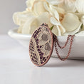 Load image into Gallery viewer, Copper Oval Pendant With 1920s French Lace On Burgundy Cotton
