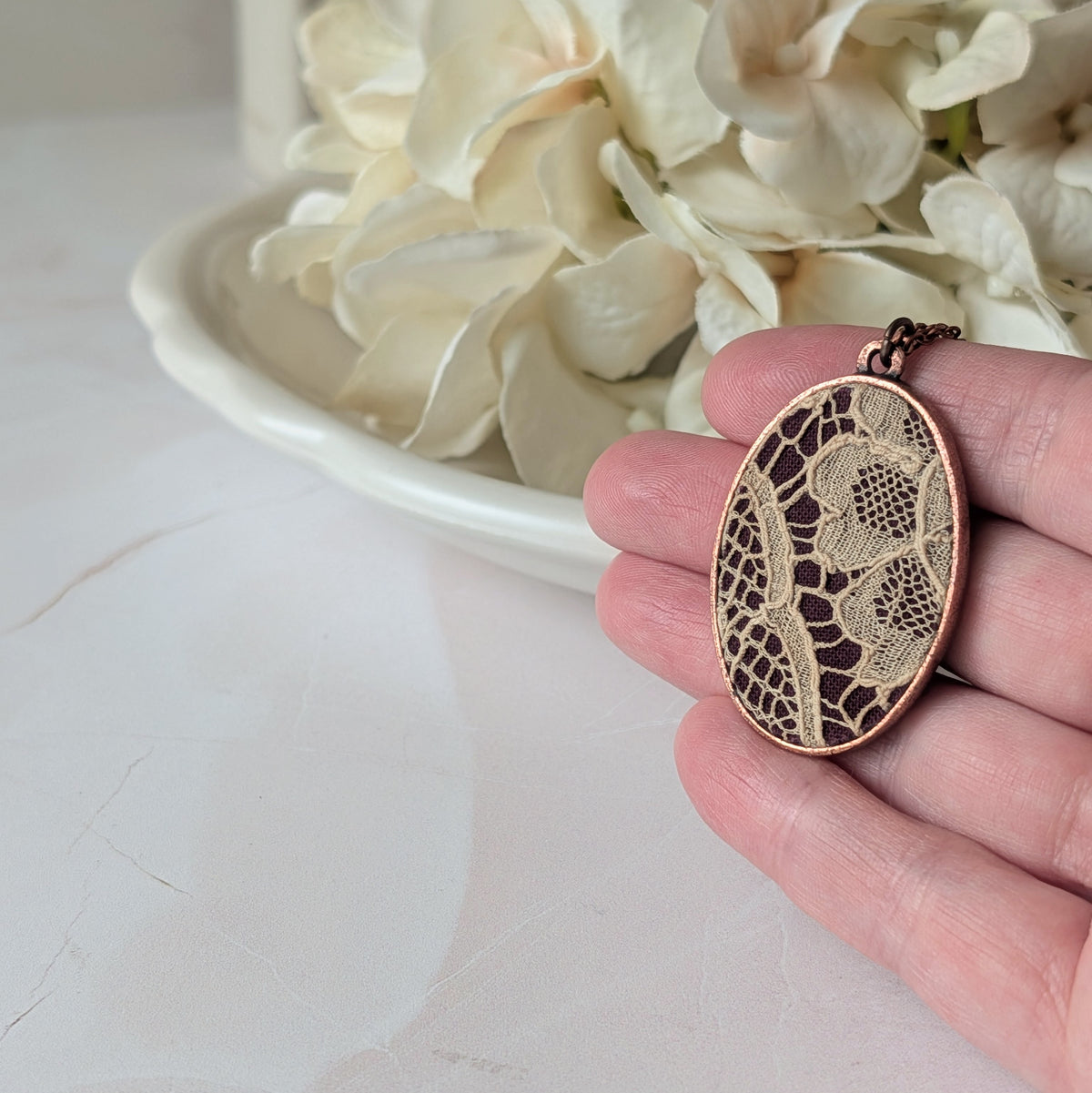 Copper Oval Pendant With 1920s French Lace On Burgundy Cotton