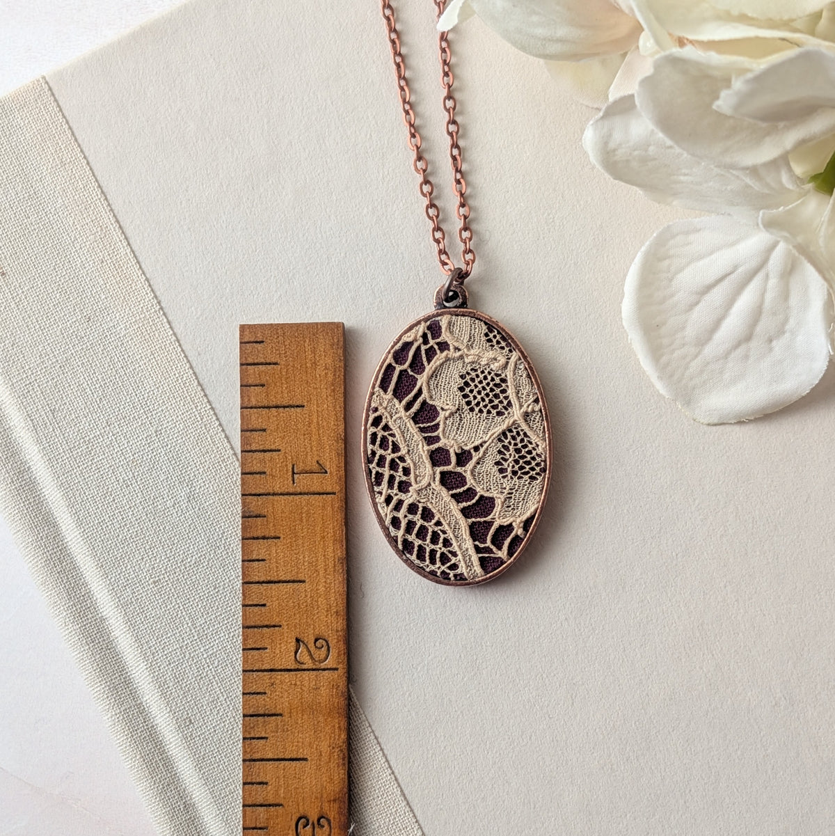 Copper Oval Pendant With 1920s French Lace On Burgundy Cotton
