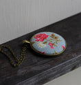 Load image into Gallery viewer, Pink Rose Necklace With Pastel Blue Background
