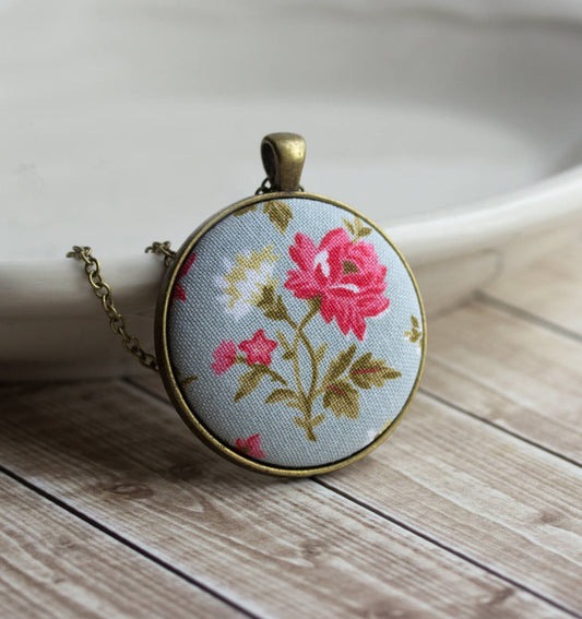 Pink Rose Necklace With Pastel Blue Background